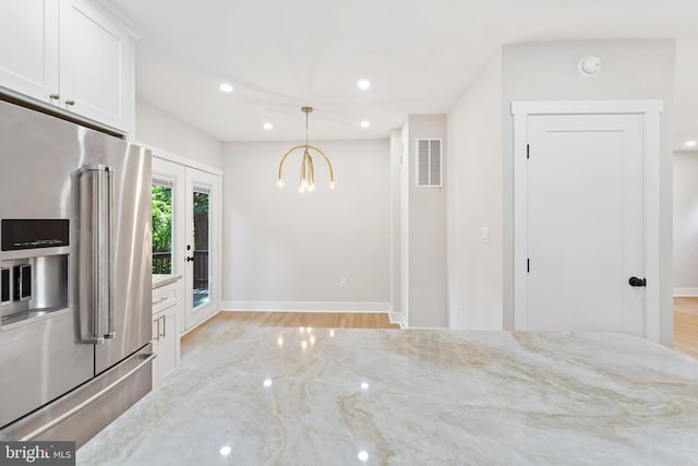 3 Knox Pl, Silver Spring, MD 20901 - kitchen featuring high end fridge, recessed lighting, white cabinets, light stone countertops, and light wood-type flooring