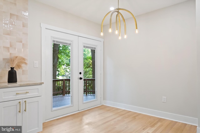 3 Knox Pl, Silver Spring, MD 20901 - entryway with french doors, light wood-style floors, and a chandelier