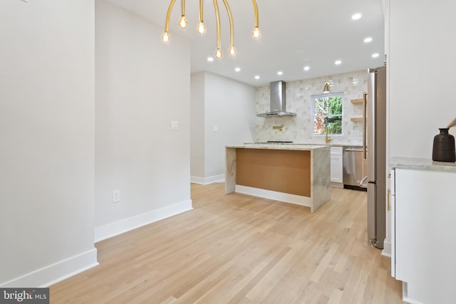 3 Knox Pl, Silver Spring, MD 20901 - kitchen featuring wall chimney range hood, appliances with stainless steel finishes, backsplash, light wood-style flooring, and open shelves
