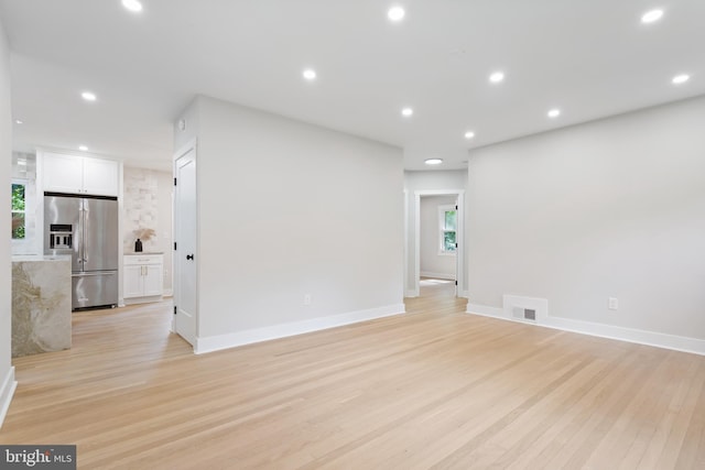 3 Knox Pl, Silver Spring, MD 20901 - unfurnished living room featuring light wood-type flooring, plenty of natural light, and recessed lighting