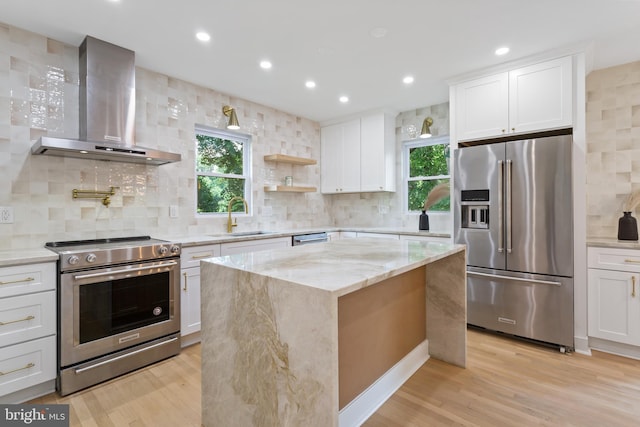 3 Knox Pl, Silver Spring, MD 20901 - kitchen featuring stainless steel appliances, wall chimney range hood, recessed lighting, light stone counters, and healthy amount of natural light