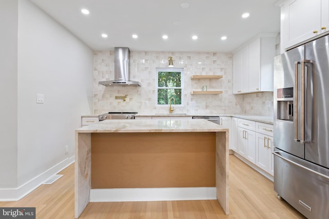 3 Knox Pl, Silver Spring, MD 20901 - kitchen with appliances with stainless steel finishes, wall chimney exhaust hood, backsplash, a center island, and recessed lighting
