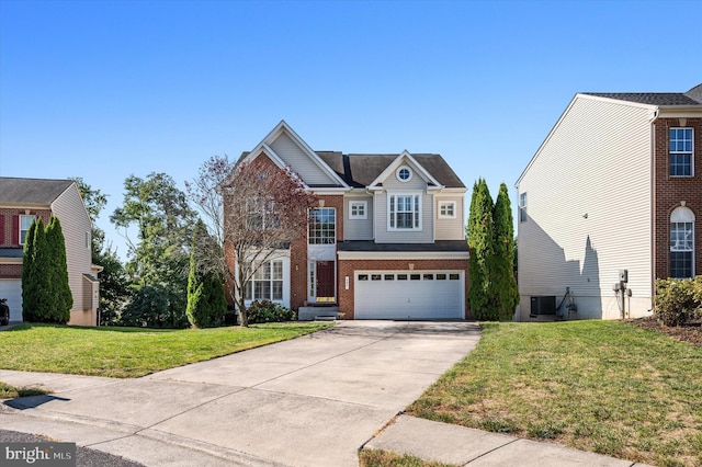 645 Beehive Way, Winchester, VA 22601 - view of front of house with driveway, central AC, a garage, a front yard, and brick siding