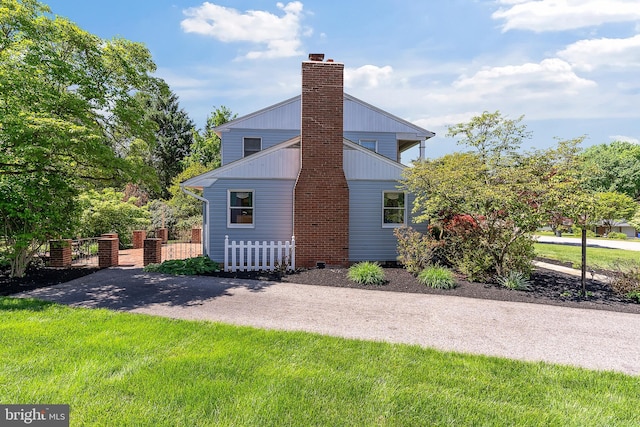 view of home's exterior with a chimney