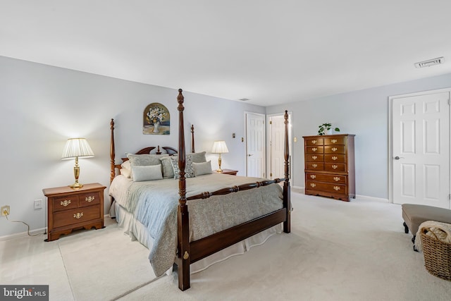 bedroom with light carpet and baseboards