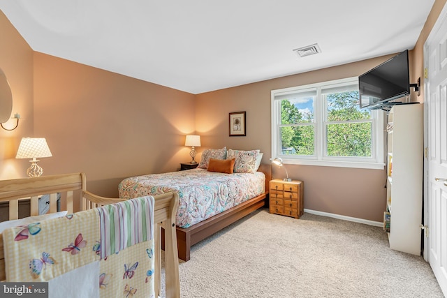 carpeted bedroom with baseboards