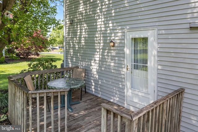 wooden deck featuring outdoor dining space