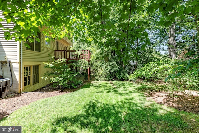 705 Upham Pl NW, Vienna, VA 22180 - view of grassy yard featuring central AC and a deck