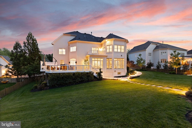 18729 Upper Meadow Dr, Leesburg, VA 20176 - back of property at dusk with a balcony and a deck