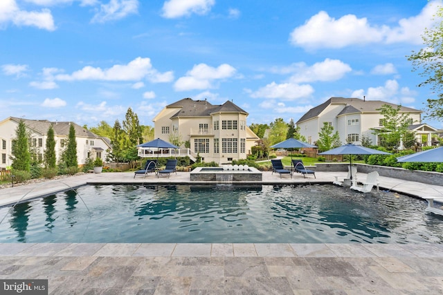 18729 Upper Meadow Dr, Leesburg, VA 20176 - view of swimming pool with a patio, a residential view, fence, and a pool with connected hot tub