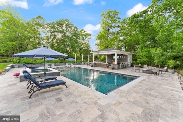 18729 Upper Meadow Dr, Leesburg, VA 20176 - view of swimming pool featuring a patio, an outdoor living space, a hot tub, fence, and view of wooded area