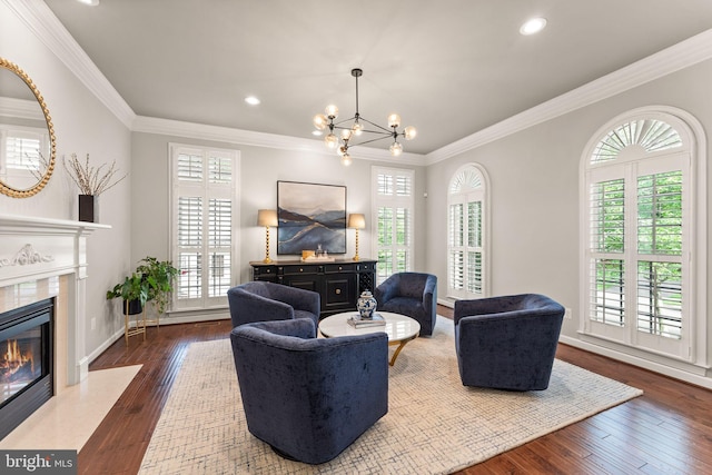 18729 Upper Meadow Dr, Leesburg, VA 20176 - living room featuring a high end fireplace, hardwood / wood-style floors, a chandelier, ornamental molding, and recessed lighting