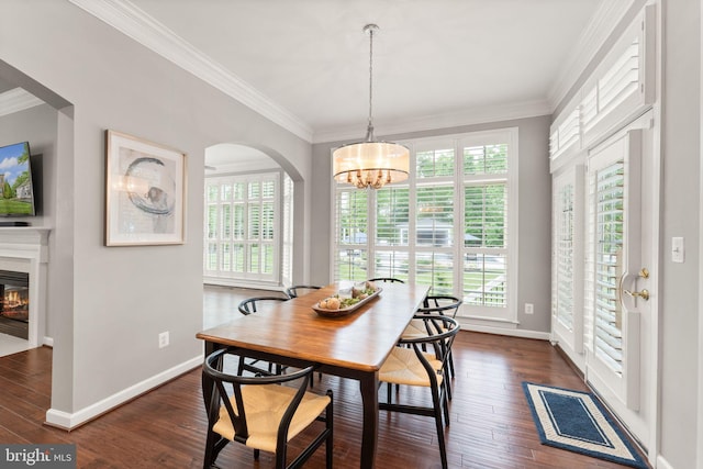 18729 Upper Meadow Dr, Leesburg, VA 20176 - dining area with plenty of natural light, a chandelier, dark wood finished floors, arched walkways, and ornamental molding