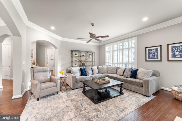 18729 Upper Meadow Dr, Leesburg, VA 20176 - living room with arched walkways, a ceiling fan, dark wood finished floors, baseboards, and crown molding