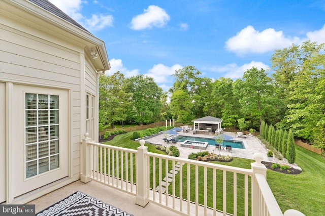 18729 Upper Meadow Dr, Leesburg, VA 20176 - balcony featuring view of pool area, a patio, and view of wooded area