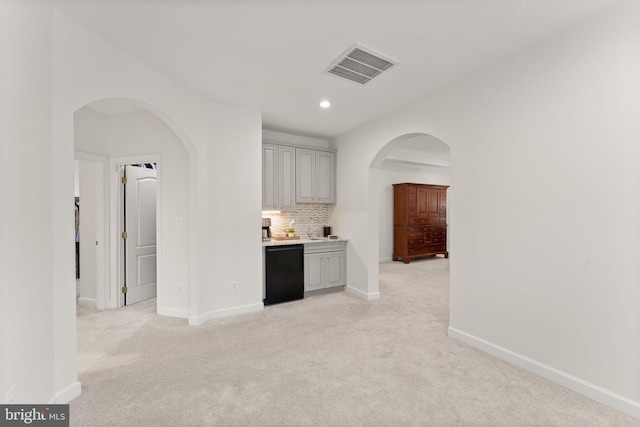 18729 Upper Meadow Dr, Leesburg, VA 20176 - corridor with light carpet, baseboards, arched walkways, and recessed lighting