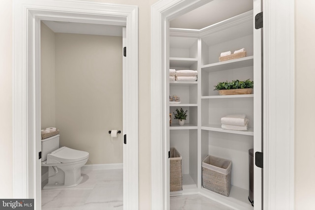 18729 Upper Meadow Dr, Leesburg, VA 20176 - bathroom with toilet, marble finish flooring, and baseboards