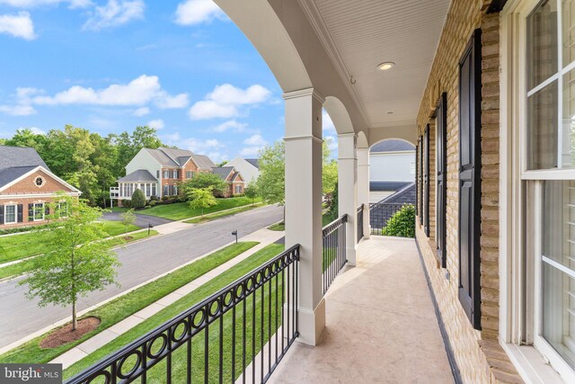 18729 Upper Meadow Dr, Leesburg, VA 20176 - balcony featuring a residential view and covered porch