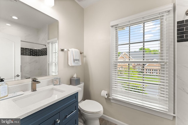 18729 Upper Meadow Dr, Leesburg, VA 20176 - bathroom with a tile shower, toilet, vanity, and baseboards
