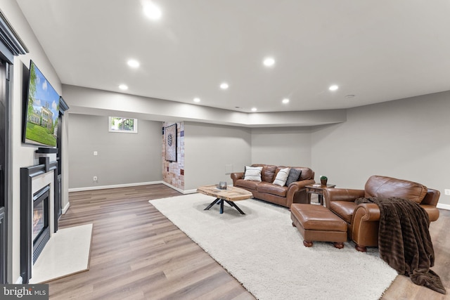 18729 Upper Meadow Dr, Leesburg, VA 20176 - living area with recessed lighting, light wood-style flooring, baseboards, and a glass covered fireplace