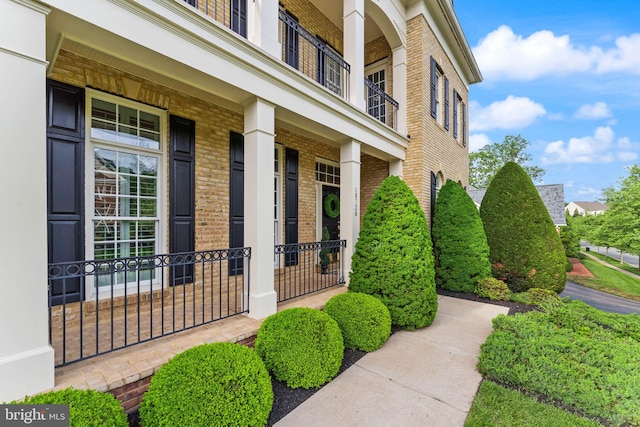 18729 Upper Meadow Dr, Leesburg, VA 20176 - view of exterior entry with brick siding and covered porch
