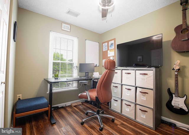 office area featuring wood finished floors, a ceiling fan, baseboards, and a textured ceiling