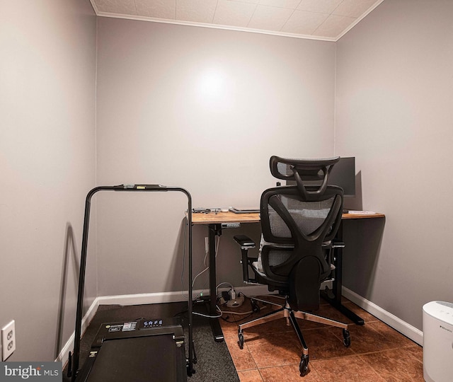 office space with crown molding and baseboards