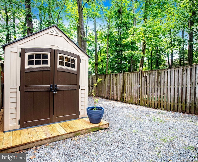 view of shed with a fenced backyard