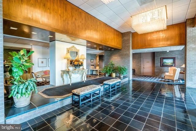 common area featuring brick wall and wooden walls