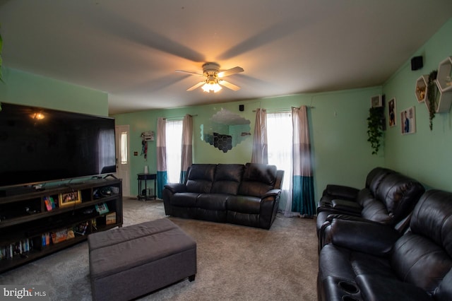 living room with plenty of natural light, carpet floors, and ceiling fan