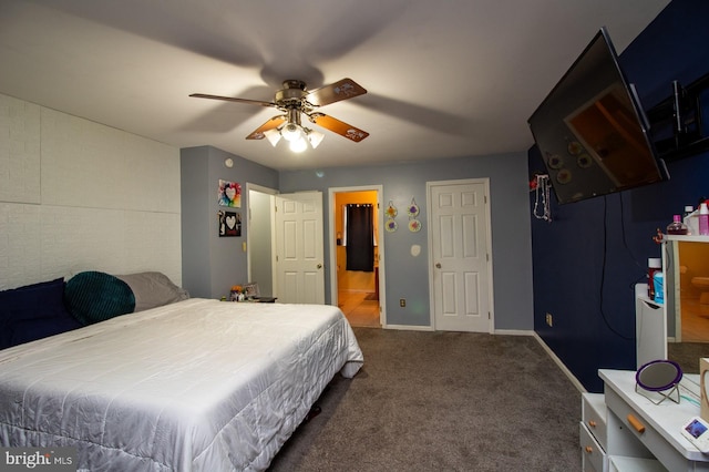 carpeted bedroom featuring baseboards and ceiling fan