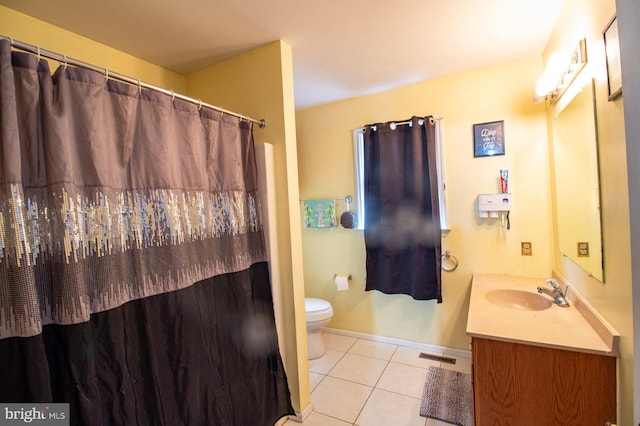 bathroom with tile patterned flooring, toilet, vanity, baseboards, and a shower with shower curtain