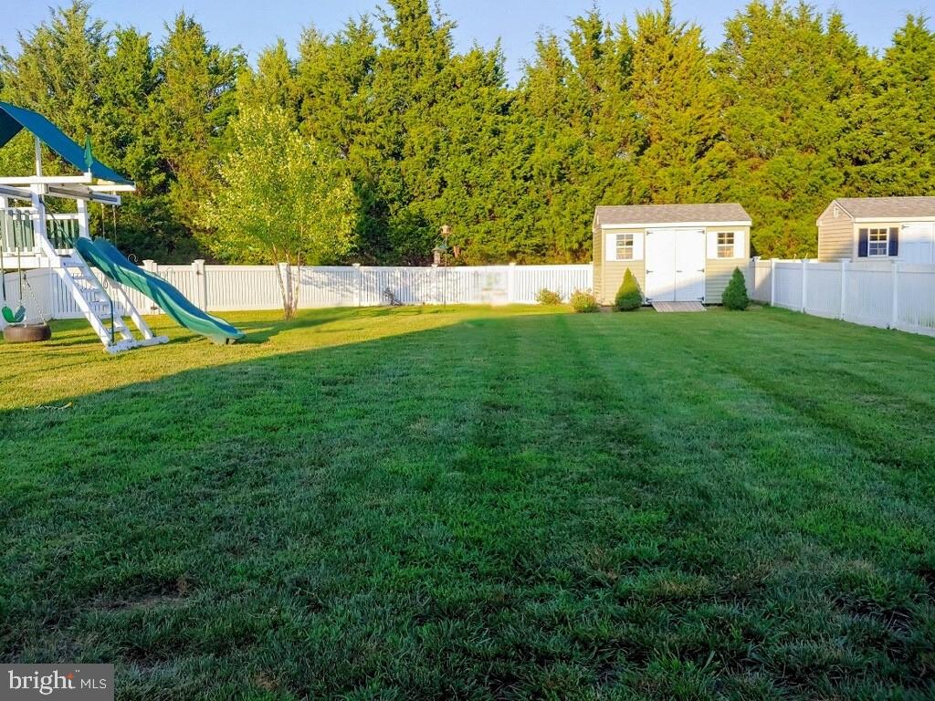 541 Conor Dr, Stevensville, MD 21666 - view of yard featuring a playground, a shed, and an outdoor structure