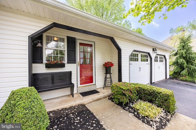 154 Plowshare Rd, Eagleville, PA 19403 - view of exterior entry featuring driveway and an attached garage