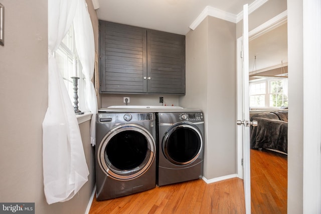154 Plowshare Rd, Eagleville, PA 19403 - washroom with washer and clothes dryer, cabinet space, wood finished floors, crown molding, and baseboards