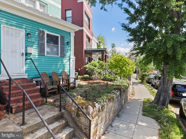 view of home's exterior featuring entry steps and brick siding
