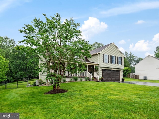 6085 Franklin Gibson Rd, Tracys Landing, MD 20779 - split level home with driveway, covered porch, and an attached garage