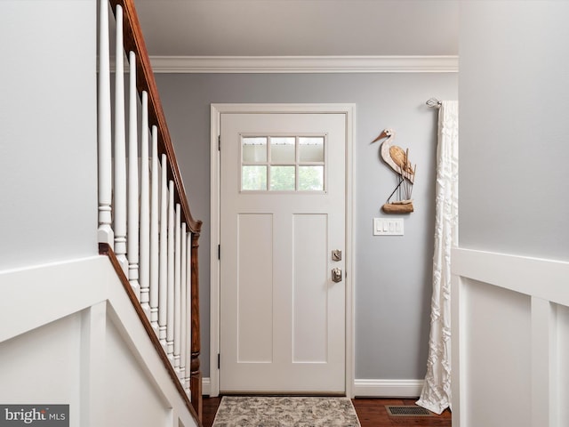 6085 Franklin Gibson Rd, Tracys Landing, MD 20779 - foyer entrance with stairs, crown molding, dark wood finished floors, and baseboards