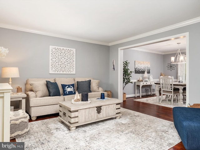 6085 Franklin Gibson Rd, Tracys Landing, MD 20779 - living room with wood finished floors, a chandelier, ornamental molding, and baseboards