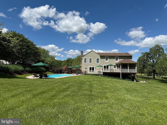 6085 Franklin Gibson Rd, Tracys Landing, MD 20779 - rear view of property featuring an outdoor pool and a deck