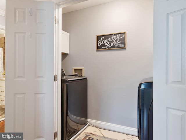 6085 Franklin Gibson Rd, Tracys Landing, MD 20779 - laundry area featuring cabinet space, washer / dryer, baseboards, and light tile patterned floors