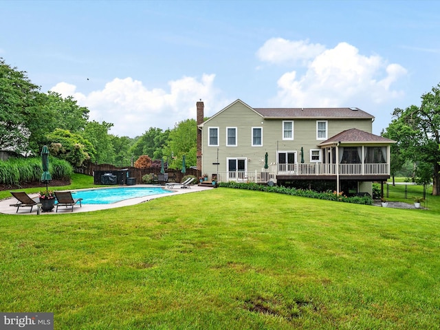 6085 Franklin Gibson Rd, Tracys Landing, MD 20779 - rear view of property featuring a chimney, a patio, and a sunroom