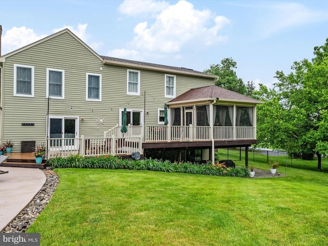 6085 Franklin Gibson Rd, Tracys Landing, MD 20779 - back of property featuring a sunroom, a deck, a lawn, and a chimney