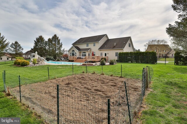 view of property's community with a deck and a swimming pool