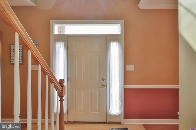 foyer entrance featuring stairway