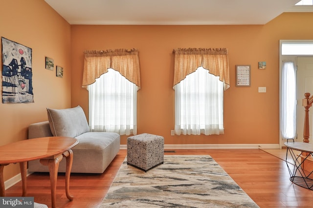 sitting room featuring wood finished floors and baseboards
