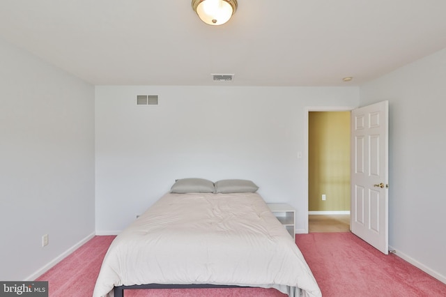 carpeted bedroom with baseboards