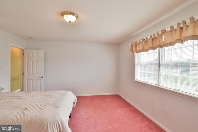bedroom featuring baseboards and carpet floors