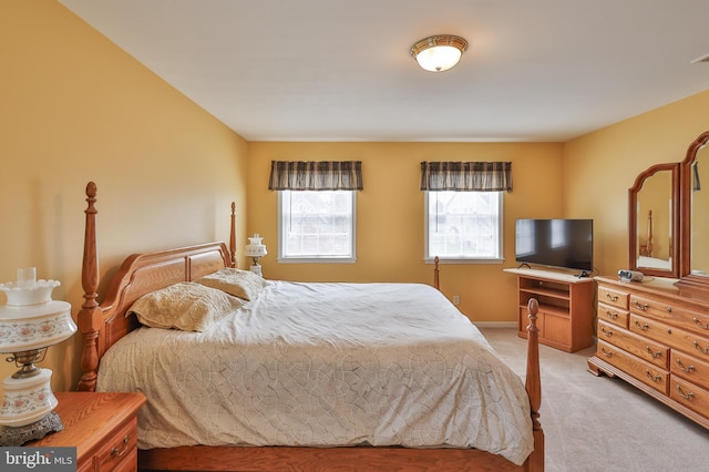 bedroom with light colored carpet