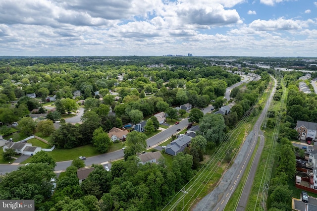 drone / aerial view of a major roadway and a tree filled landscape